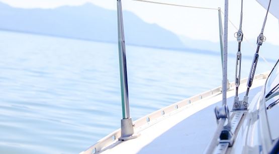 White yacht on blue sea, view of horizon