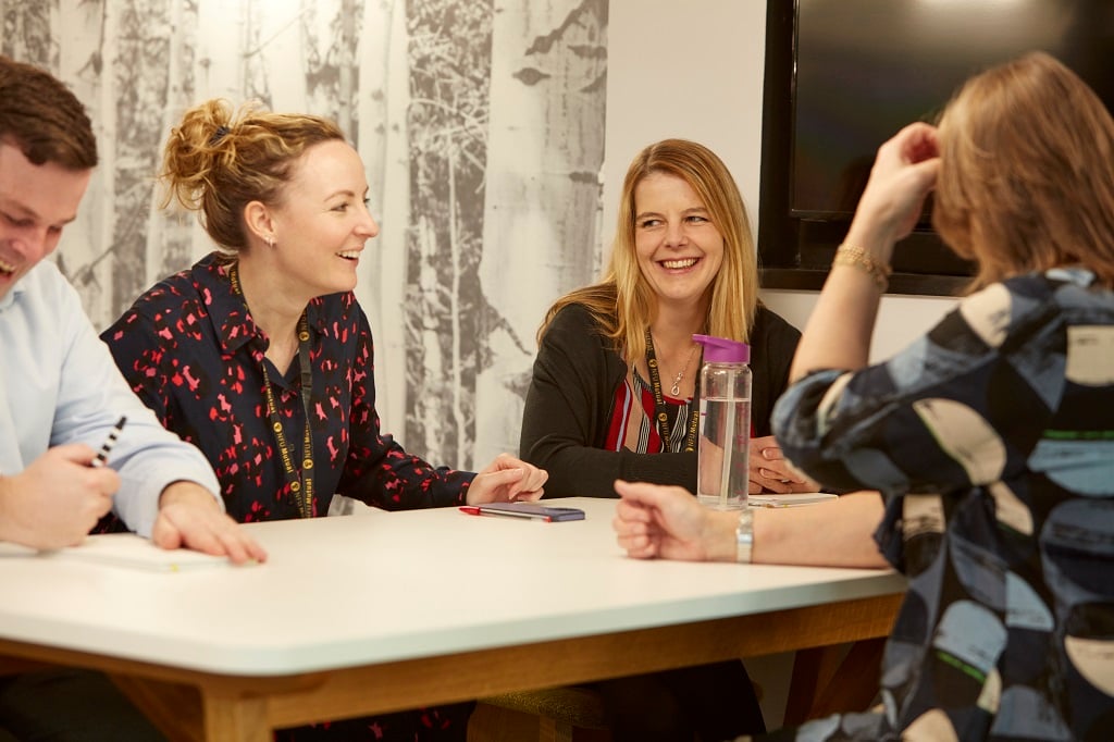 employees around a desk