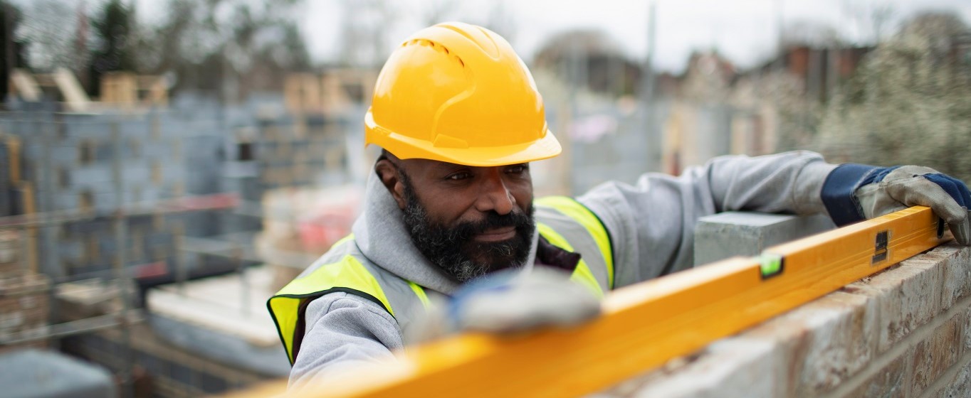 builder with spirit level