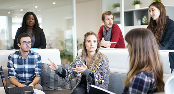 Team of six people in creative meeting