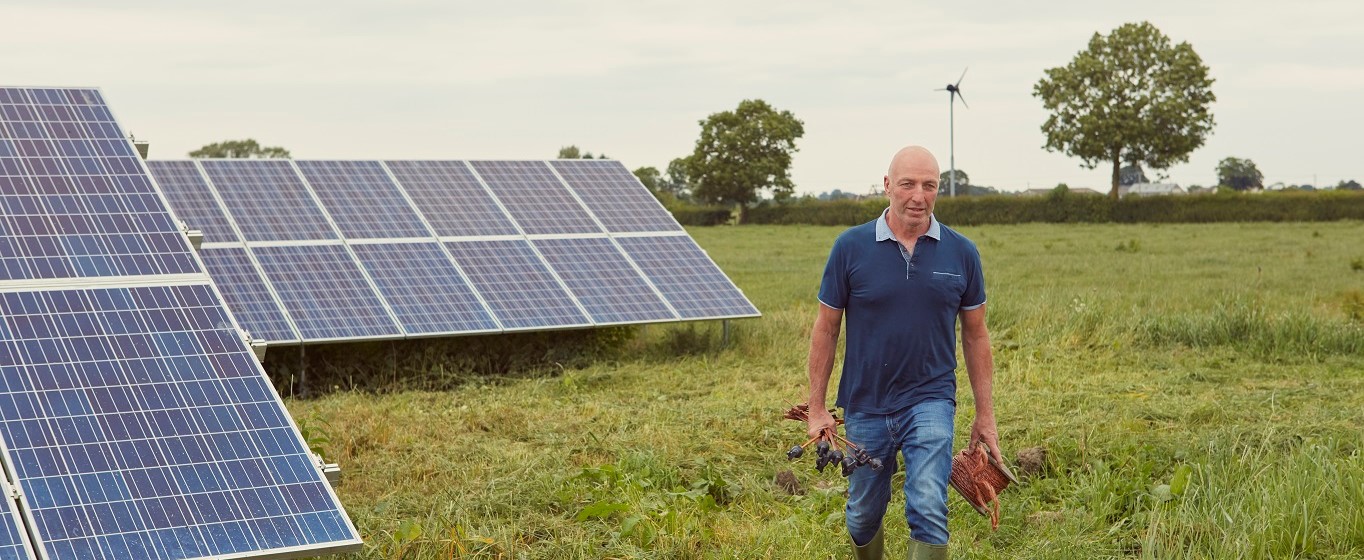 farmer with solar panels