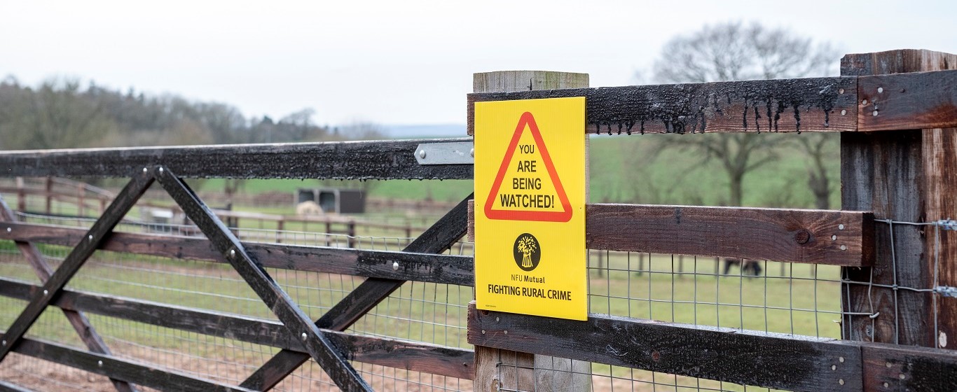 fighting rural crime sign on a gate