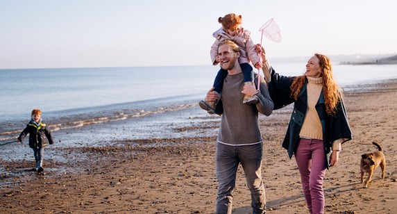 Family walking along beach