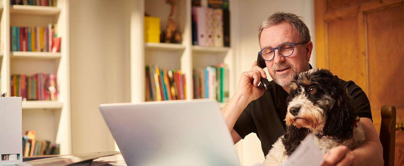 man-and-his-dog-at-a-desk