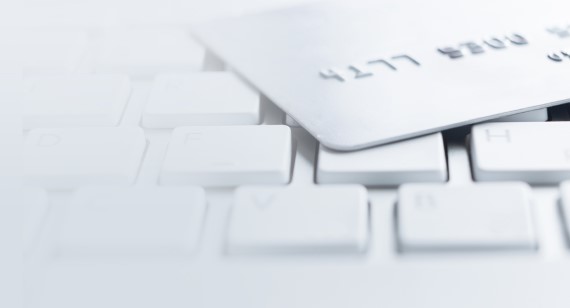 Credit card laying on computer keyboard