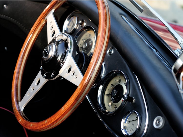 Classic car steering wheel and dashboard