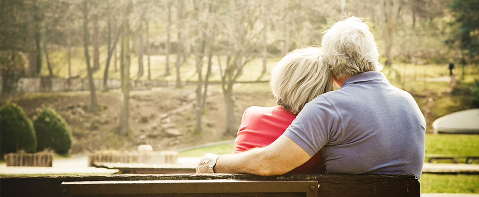 older couple sat on a bench