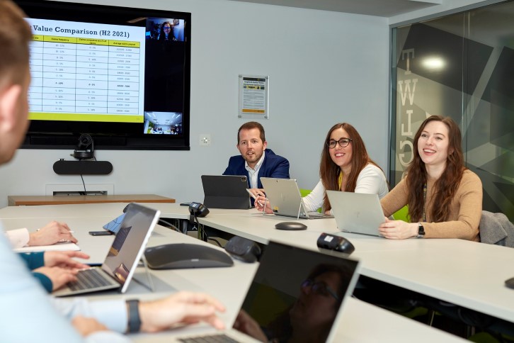 colleagues-hybrid-working-in-meeting-room-1366.jpg